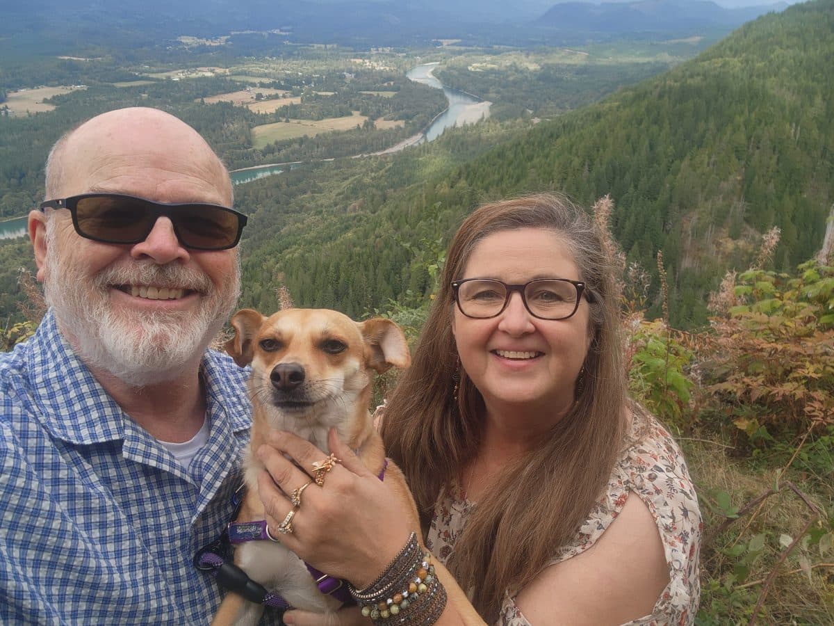 Kim, Brien and Lucy at the top of Mount Finley with the Skagit River valley behind them