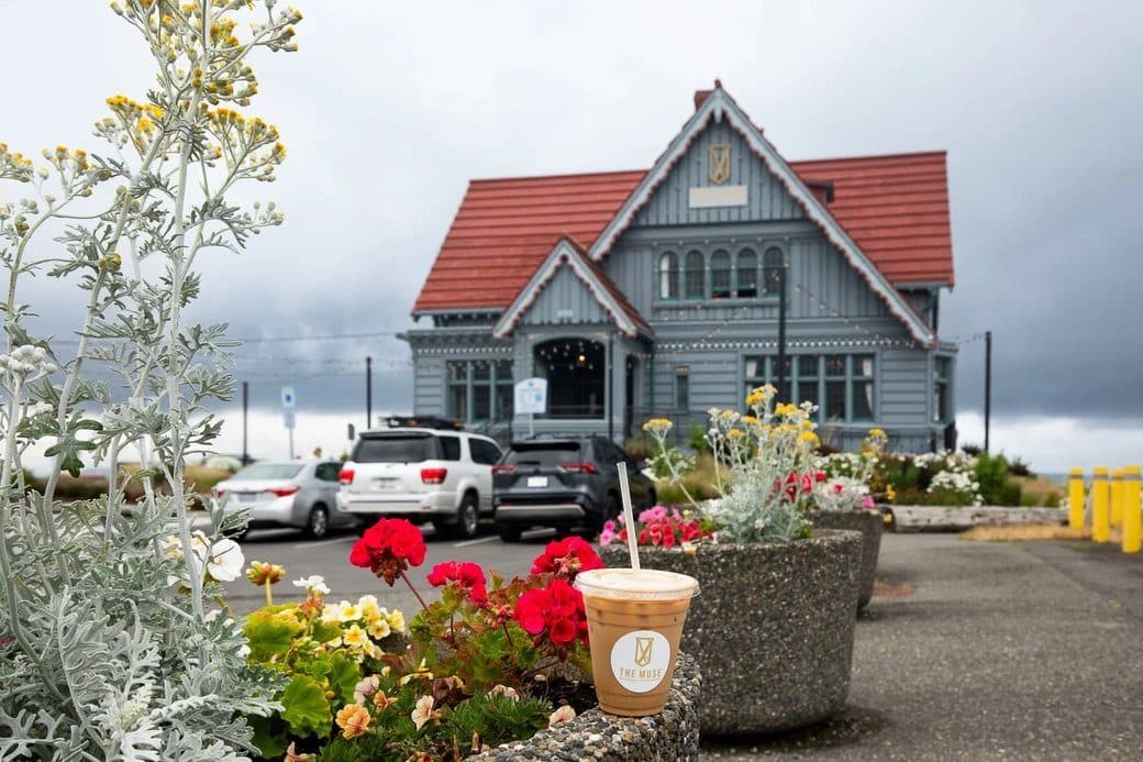 Muse coffee bar in Everett with a coffee cup on the flower planter