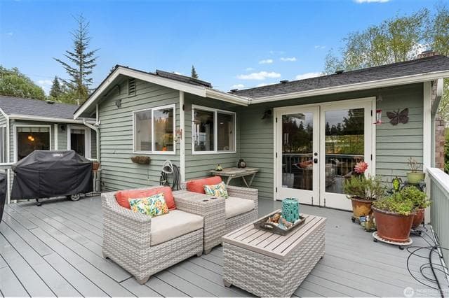 Upper deck with patio set, gas grill, French doors, outdoor living facing the view