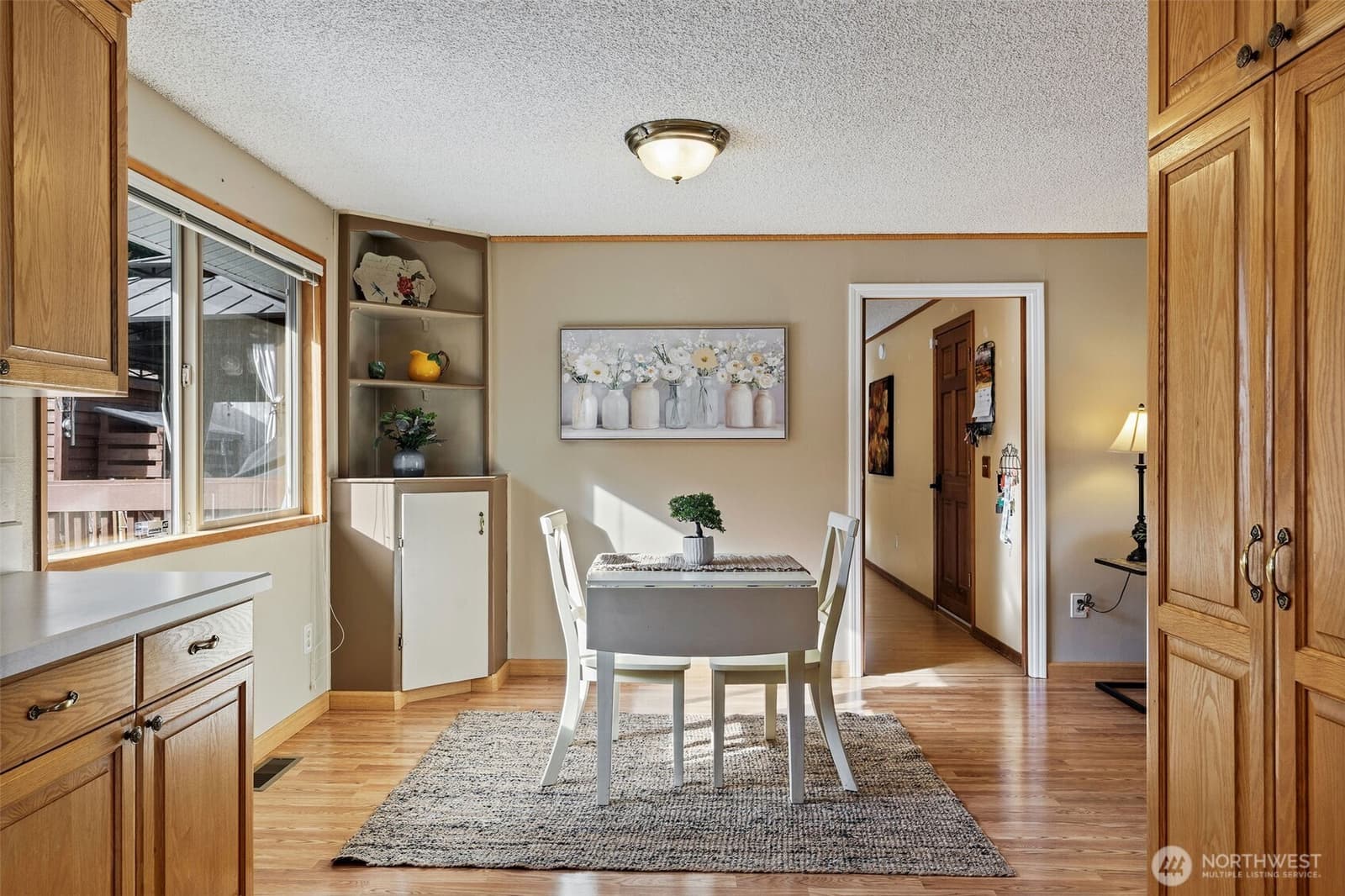 Dining area off the kitchen with built-in shelving at 17104 24th Ave SE, Bothell WA