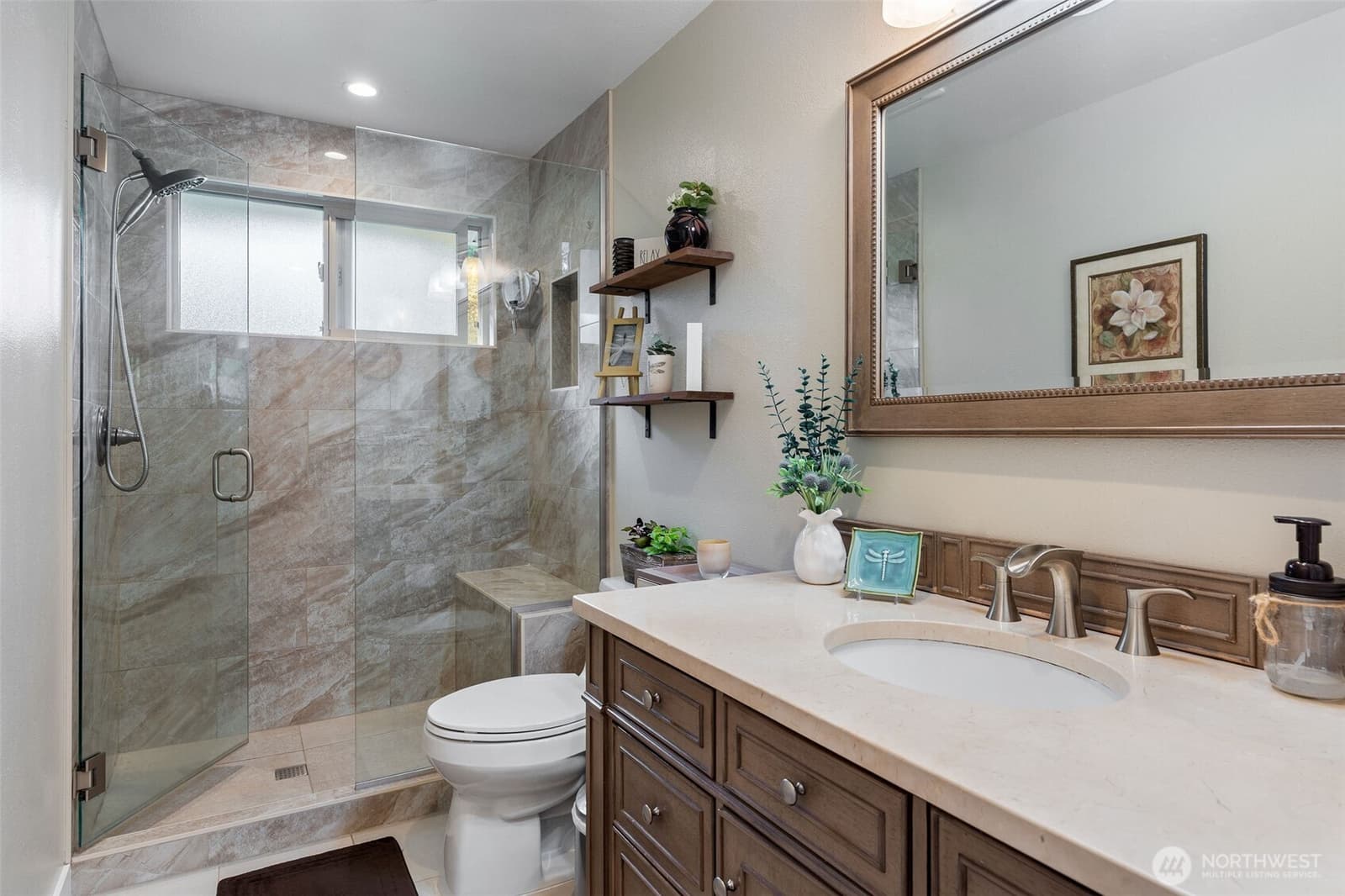 Remodeled bath with a tiled walk-in shower at 17104 24th Ave SE, Bothell WA