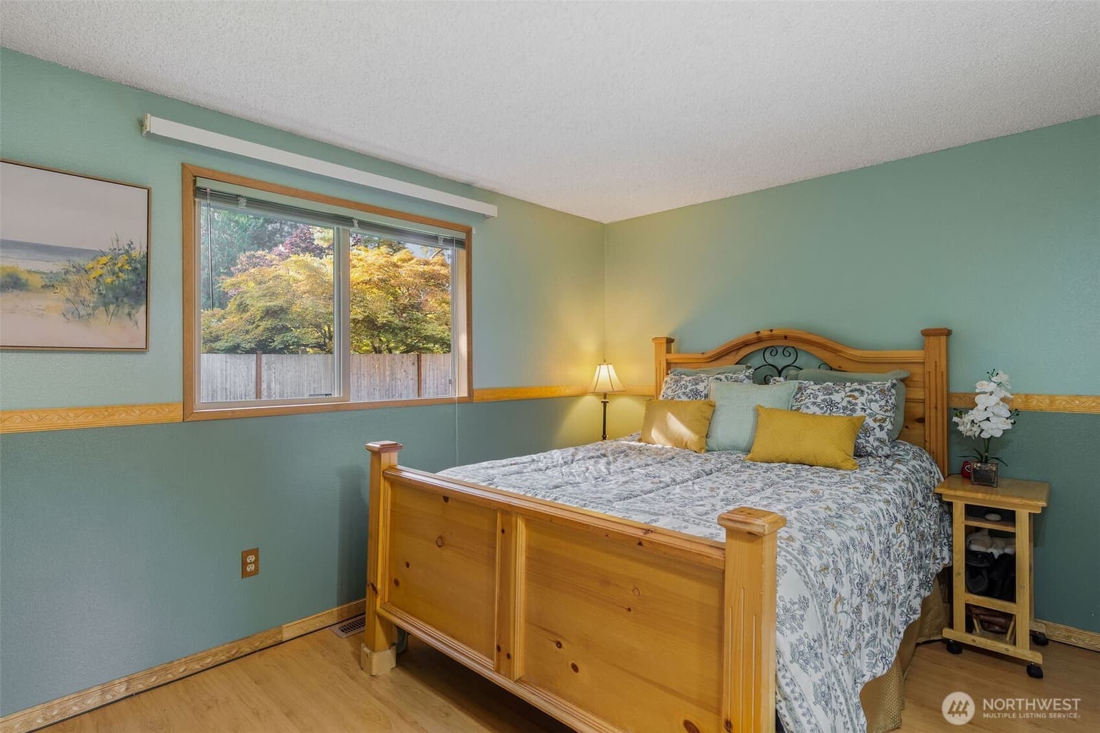 Primary bedroom with windows to the yard at 17104 24th Ave SE, Bothell WA