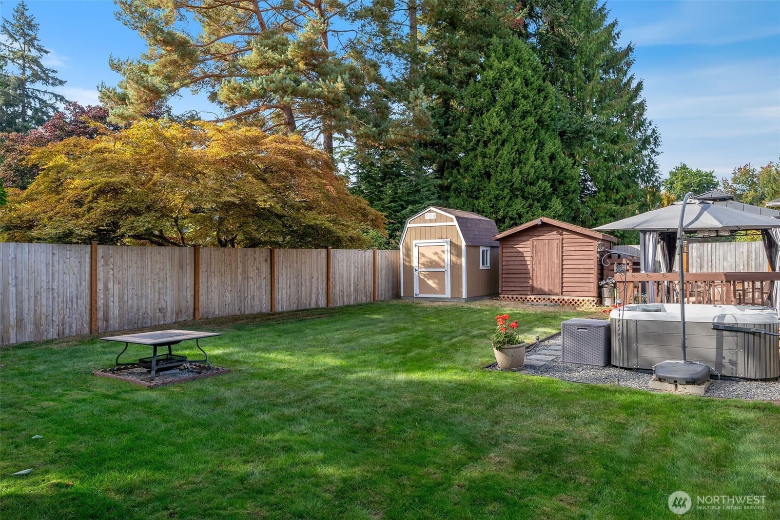 Fully fenced back yard with a shed at 17104 24th Ave SE, Bothell WA